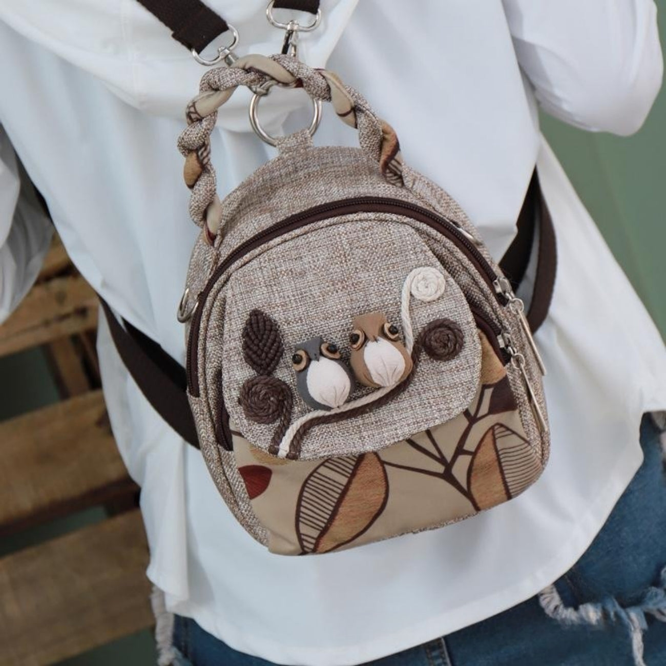 The Happy Bird canvas backpack can be carried by hand, crossbody, and fashionable for commuting on both shoulders